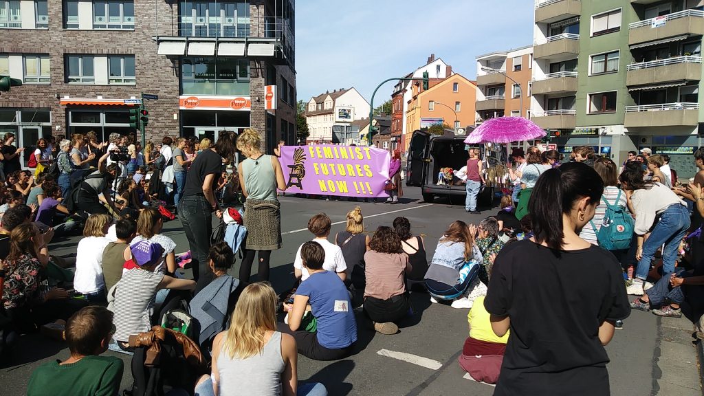 This image has an empty alt attribute; its file name is rally-feministFuturesFestival20190914_152526-e1568905553685-1024x576.jpg